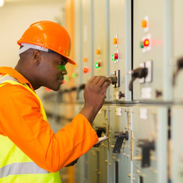 Abuja ELectricity Distribution Company (AEDC) Staff working on an electric circuit.