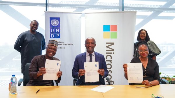 Officials of UNDP-Nigeria and African Development Center of Microsoft during signing of the MoU